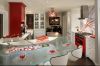 Cheerful kitchen design with red and white cabinetry